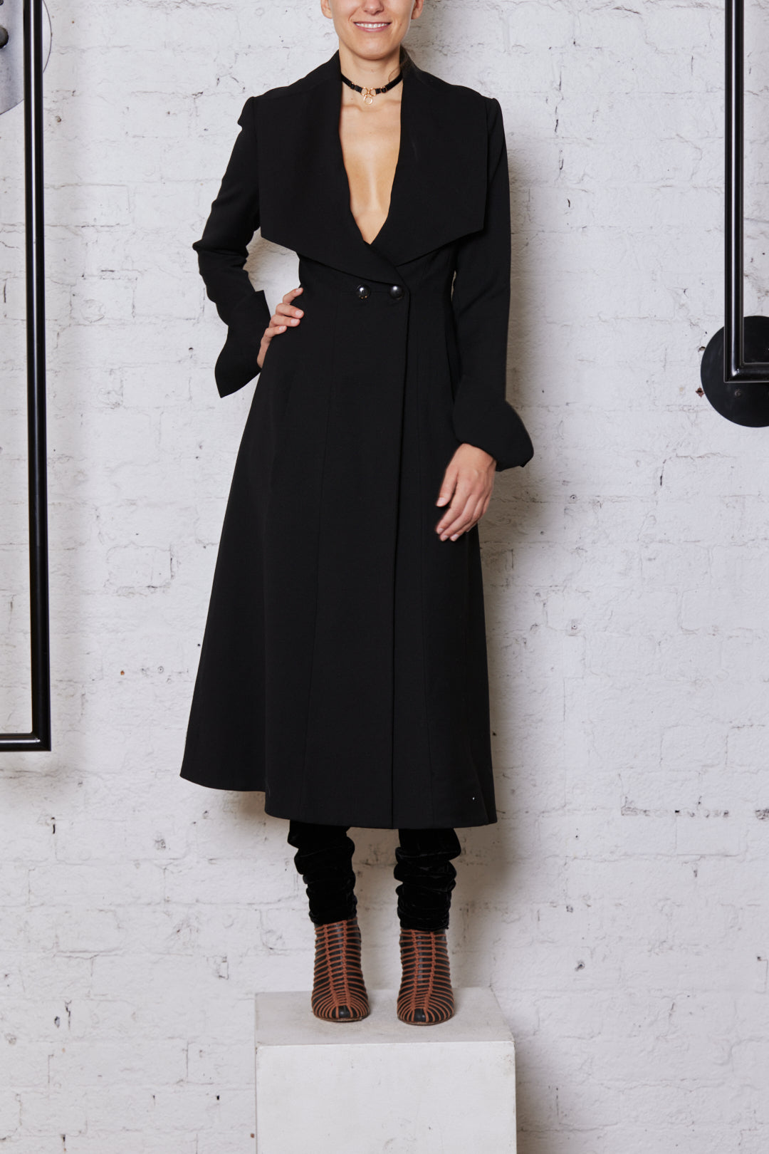 Overcoat with outlet cape